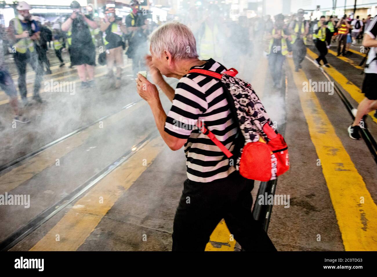 Hong Kong, Hong Kong. 8th Sep, 2019. An elderly covers her face while fleeing away from the tear gas at Causeway Bay during an anti-government demonstration.Pro- democracy and anti-government demonstrations in Hong Kong that demanded the withdraw of the controversial extradition bill, which included an independent inquiry into police brutality, the retraction of the word ''riot'' to describe the rallies, and genuine universal suffrage as the territory faced a leadership crisis. Credit: Viola Kam/SOPA Images/ZUMA Wire/Alamy Live News Stock Photo