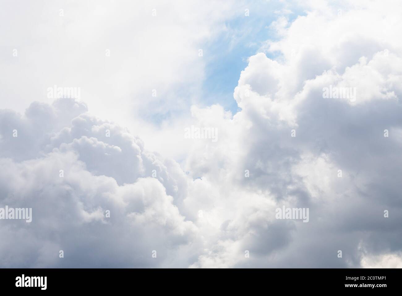 Gray and white fluffy clouds in the pale sky. Beautiful sky Stock Photo