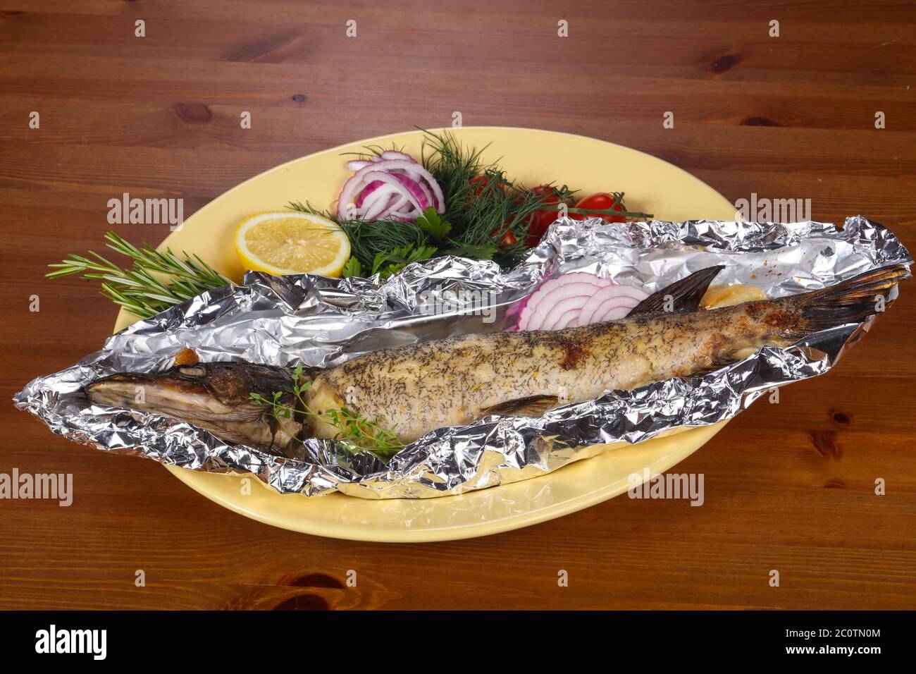 Stuffed baked pike with lemon and rosemary Stock Photo - Alamy