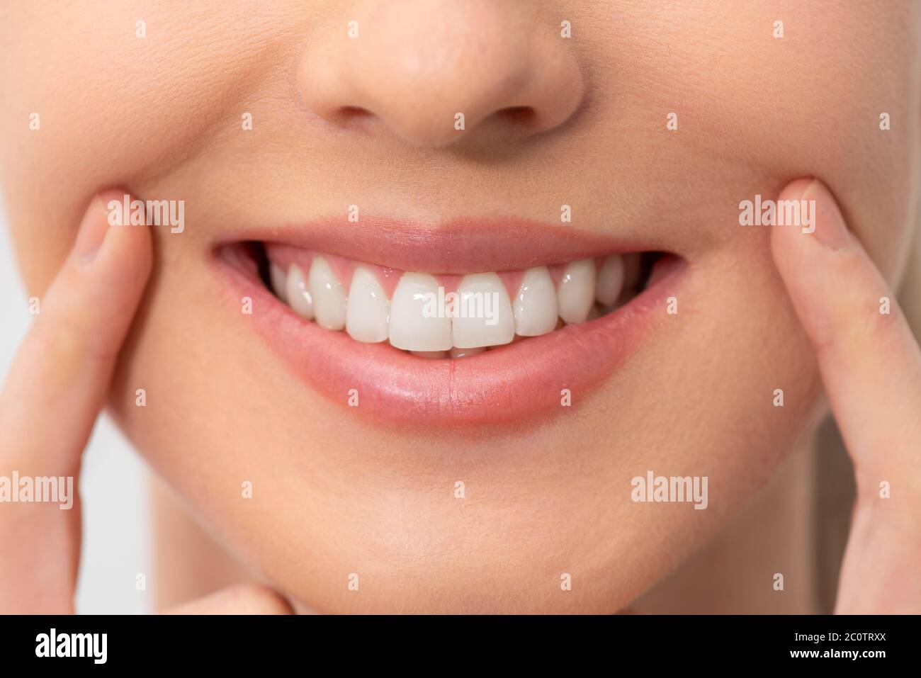 Woman showing perfect smile. Teeth whitening, dental care concept Stock  Photo - Alamy