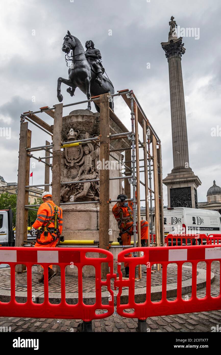 London, UK. 12th June, 2020. The statue of Charles I, is covered up in response to fears that the protests by Black Lives Matter will lead to it being damaged by people climbing on it. It is one of the oldest statues in London. Credit: Guy Bell/Alamy Live News Stock Photo