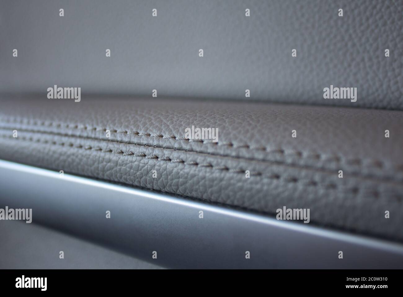 Car interior - white gray leather texture with seams Stock Photo