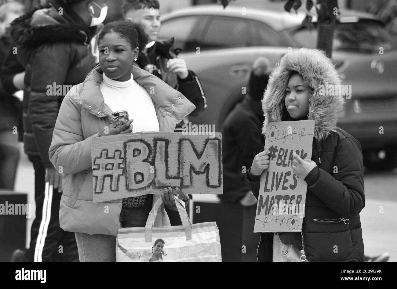 Two black sisters attending a black lives matter protest in Swindon in the UK in 2020 Stock Photo