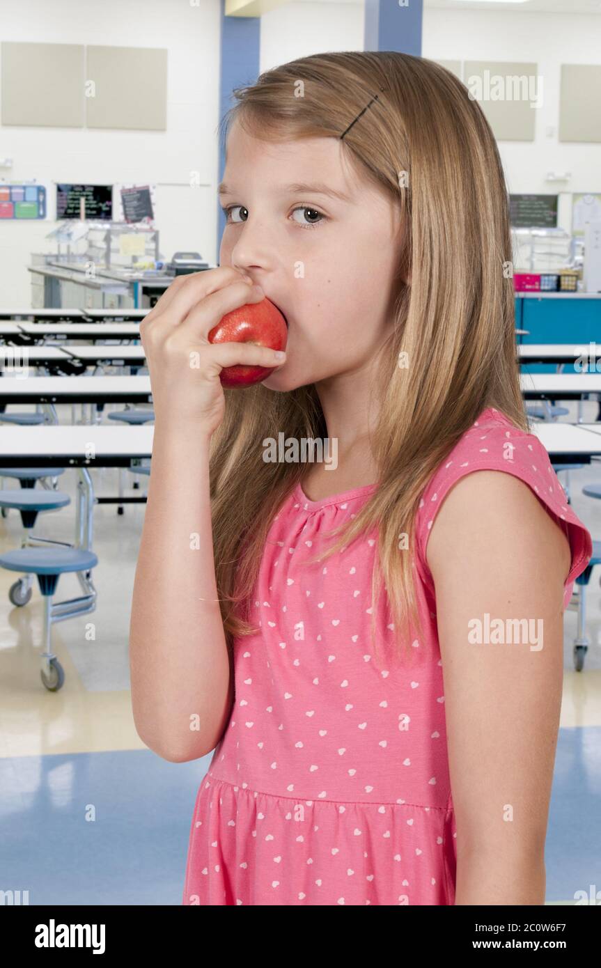 Little Girl Eating an Apple Stock Photo