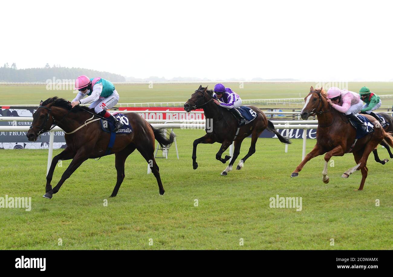 Siskin ridden by Colin Keane (left) wins the Tattersalls Irish 2000 Guineas at Curragh Racecourse. Stock Photo