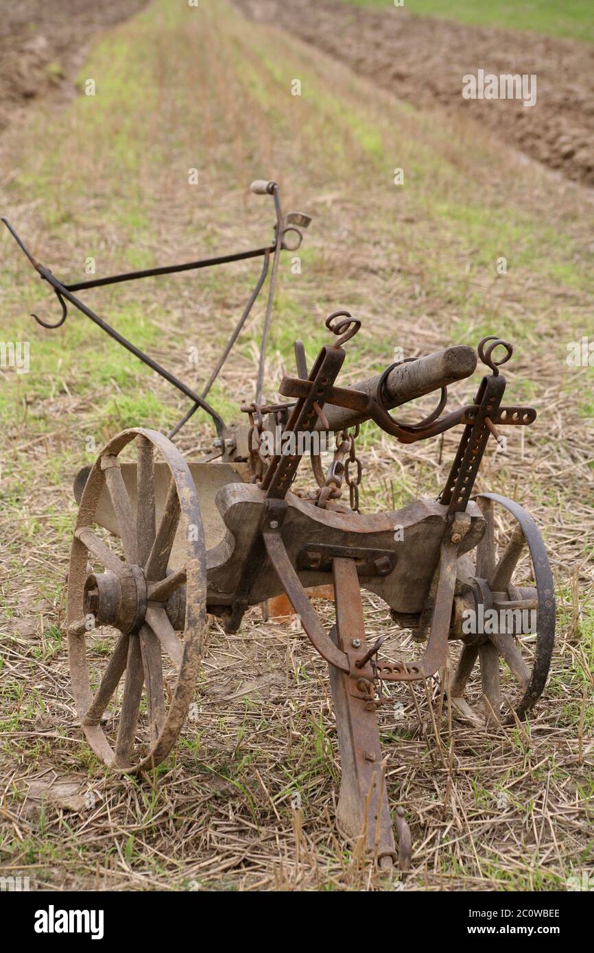 historical agriculture farming field harness wheels acre formerly farmer Stock Photo