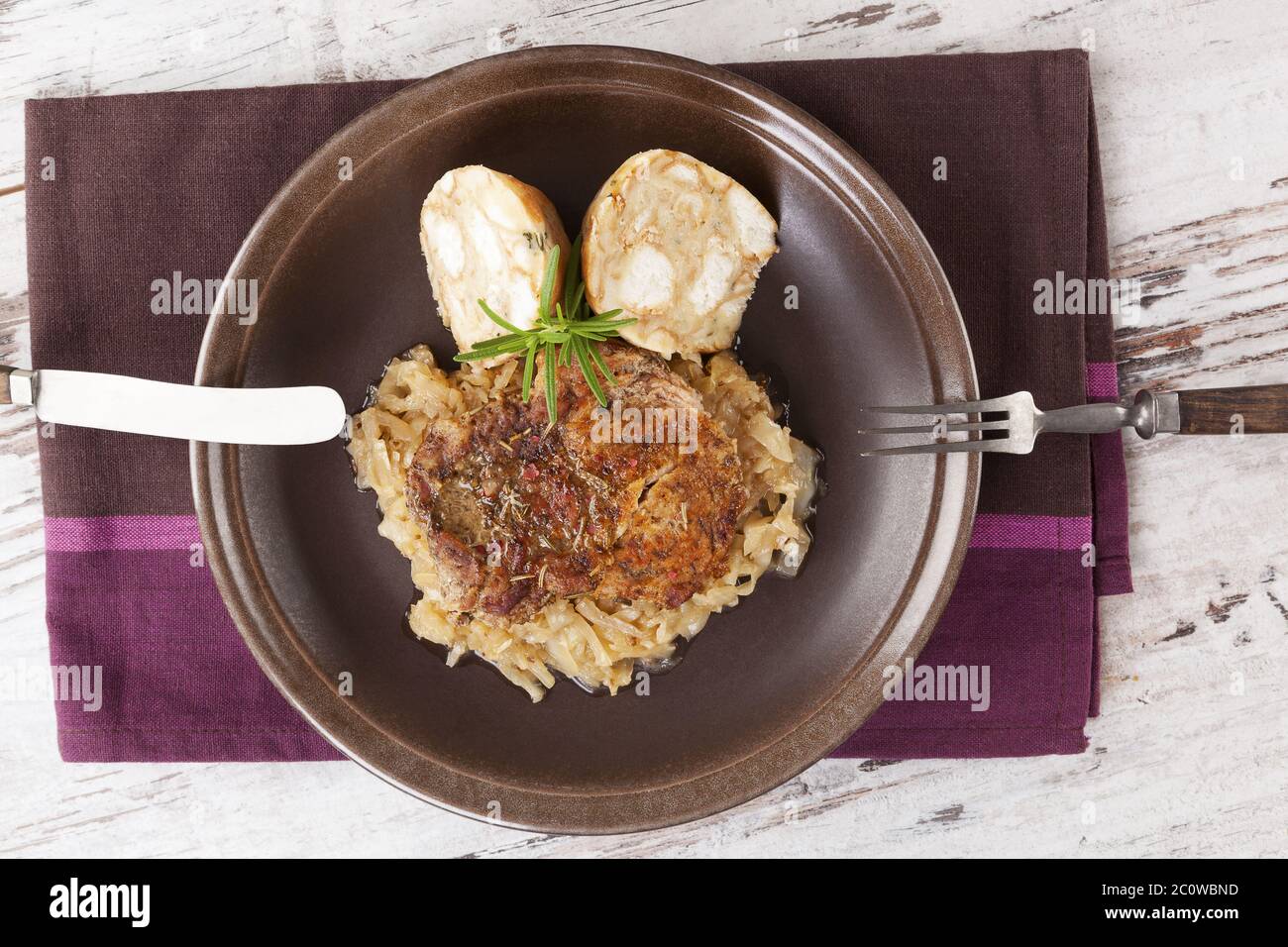 Baked pork chop with dumplings and sauerkraut Stock Photo Alamy
