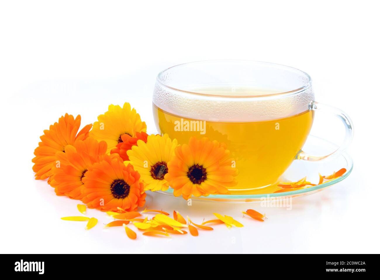 orange tea flower plant marigold herb tea yellow cup glass chalice tumbler Stock Photo