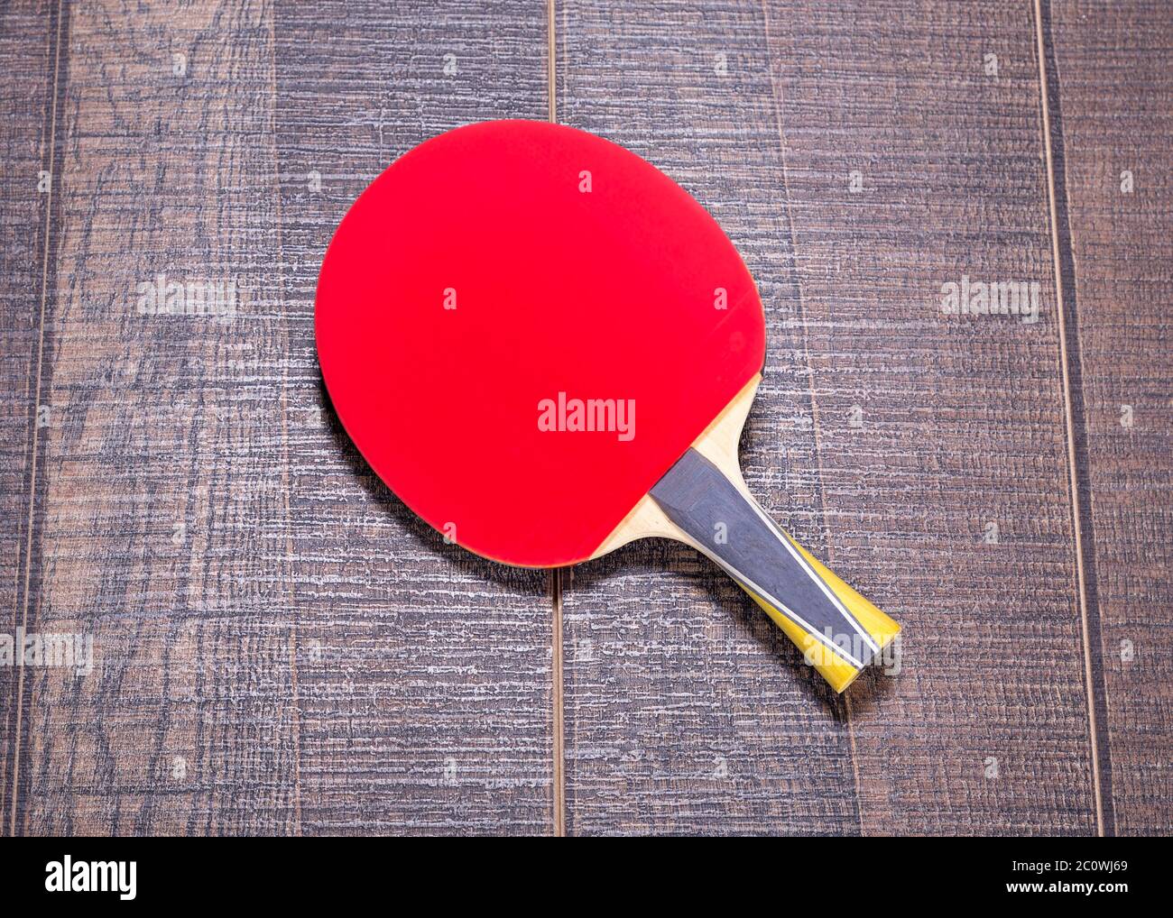 Red side of table tennis bat on wood Stock Photo Alamy