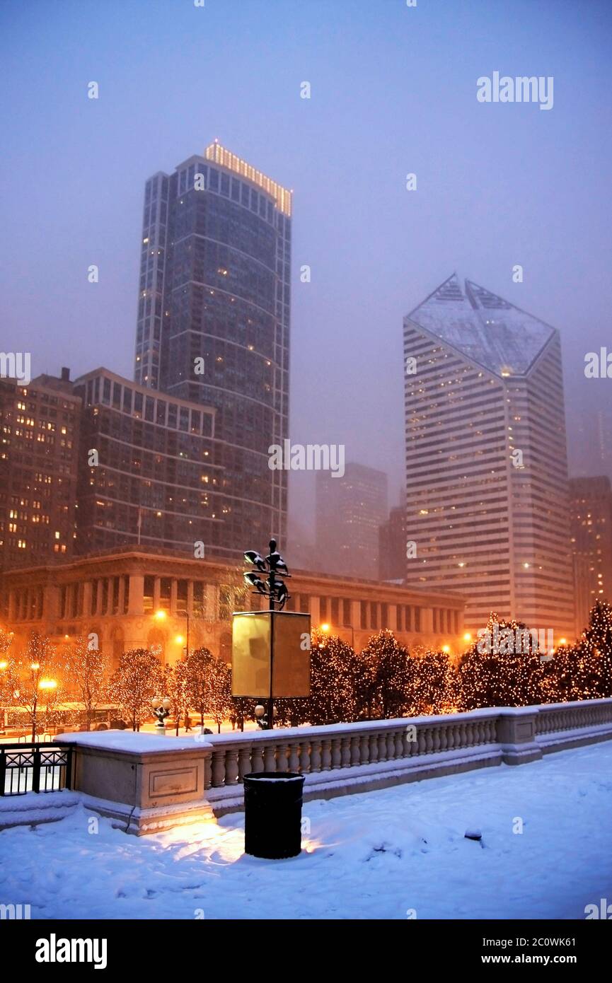 Cityscape with snowfall and street lights in the center of Chicago