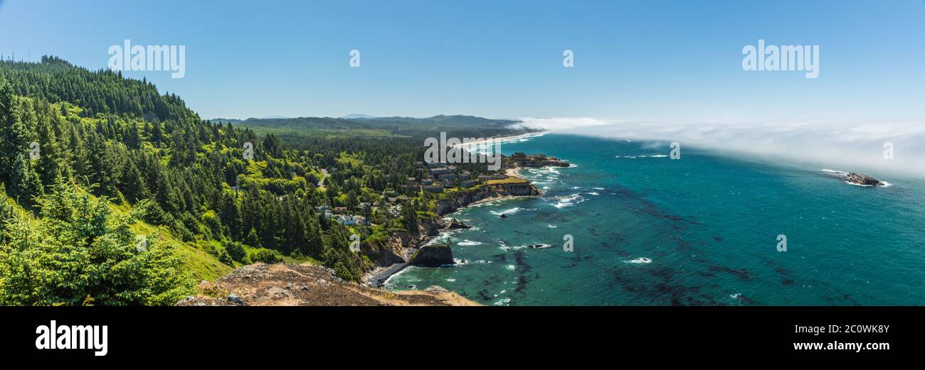 Panoramic view of Fog bank off shore and rugged hills along the Oregon coast near Cape Foulweather. Stock Photo