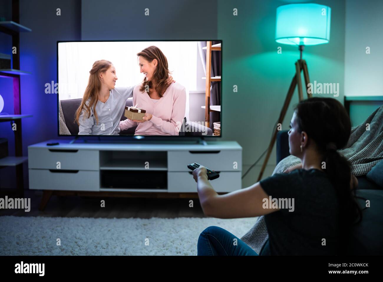 Woman Watching TV On Couch Or Sofa. Watch Television Stock Photo Alamy