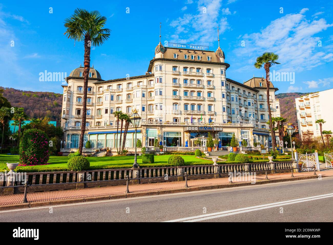 STRESA, ITALY - APRIL 10, 2019: Regina Palace Hotel in the centre of Stresa town located at the shores of Lago Maggiore Lake in northern Italy at suns Stock Photo