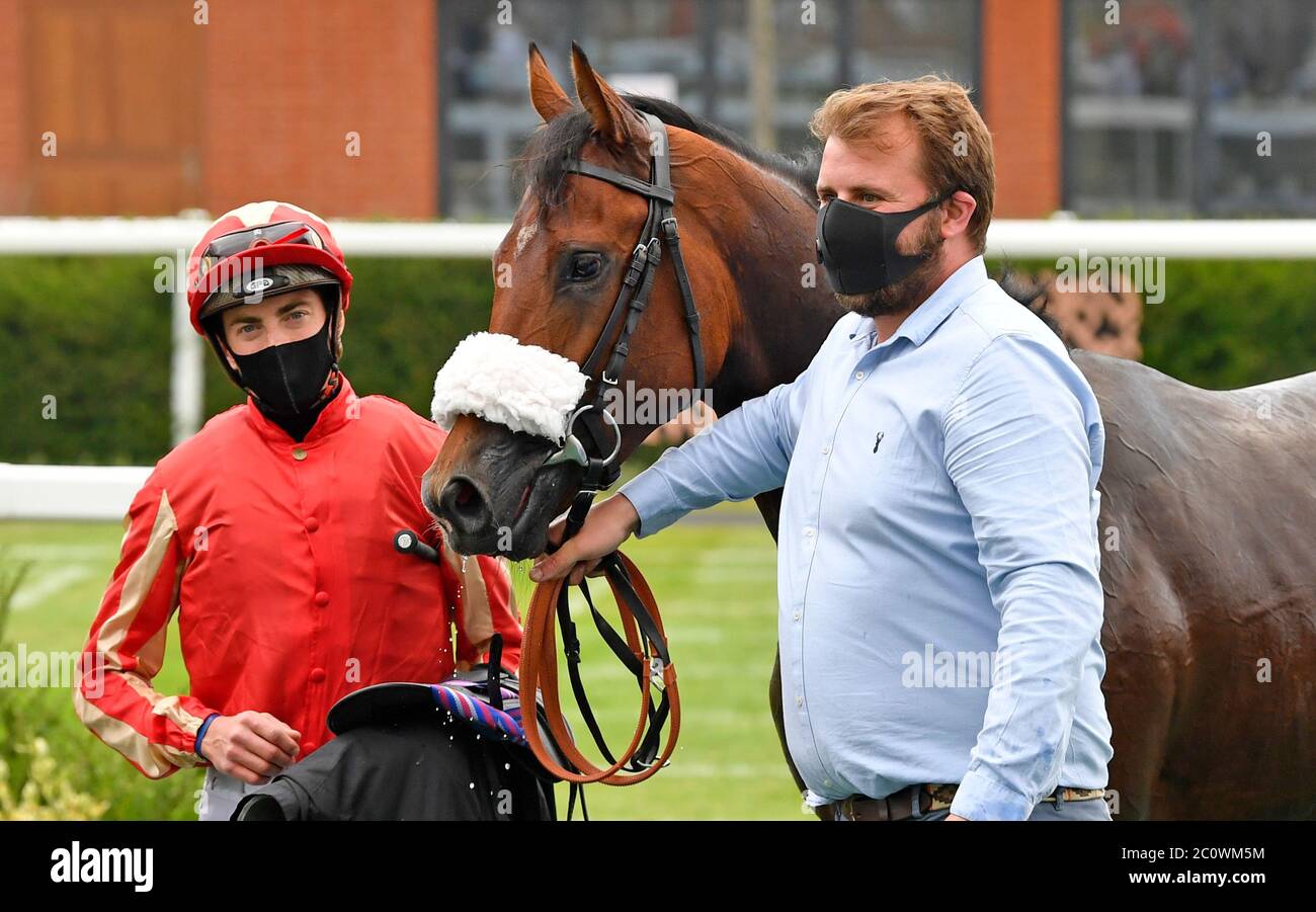First Prophet and James Doyle after winning the It's Not Rocket Science with MansionBet EBF Novice Stakes at Newbury Racecourse. Stock Photo