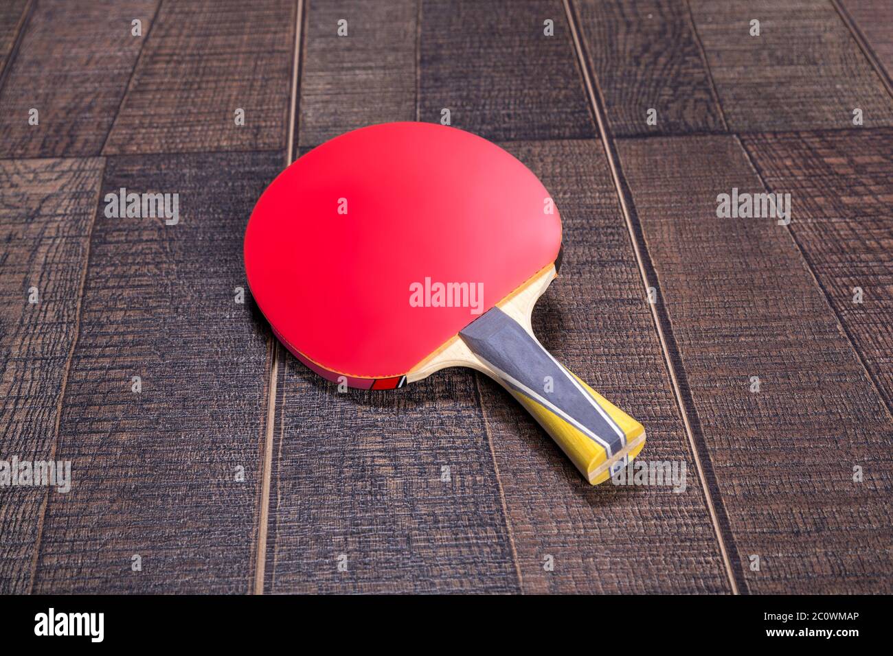 Red side of table tennis bat on wood Stock Photo Alamy