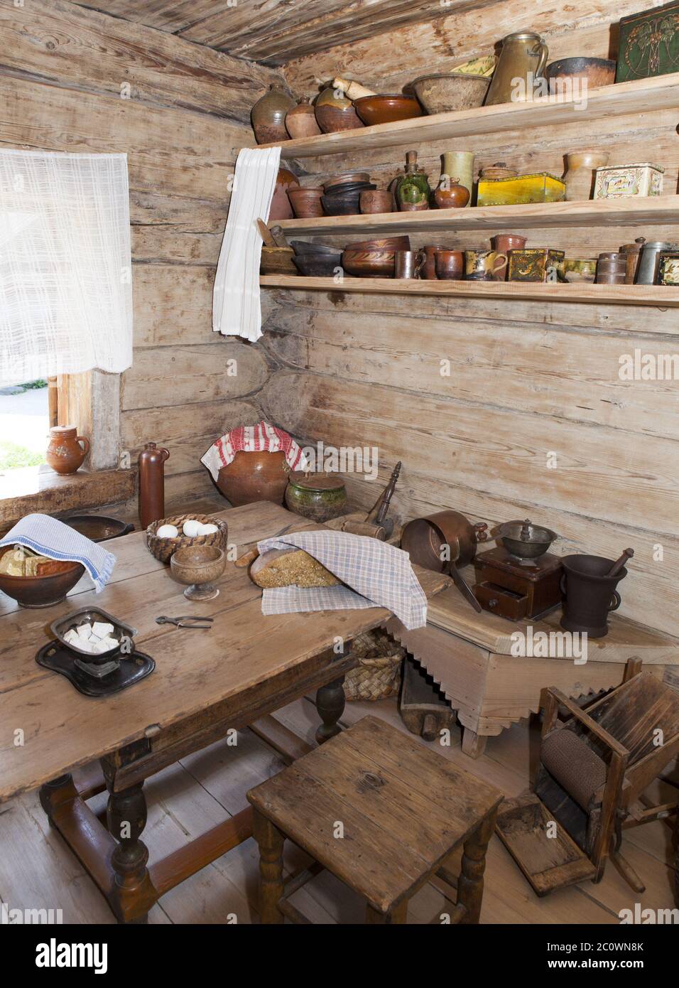 ancient kitchen in a wooden log hut, Russia Stock Photo