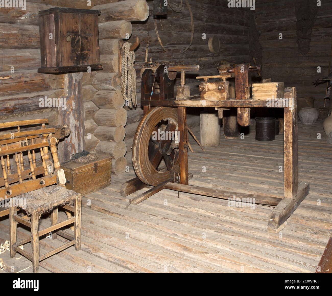 ancient interior of the room of the weaver in a wooden log hut, Russia Stock Photo