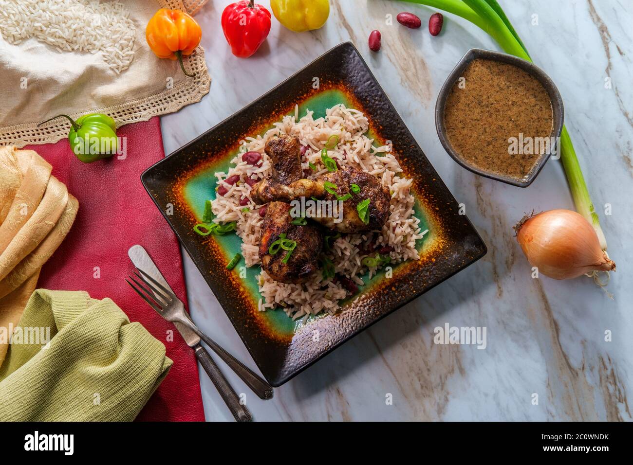Authentic Spicy Jamaican Jerk Chicken Legs With Scotch Bonnet Chili Peppers Served With Coconut Rice And Peas Stock Photo Alamy