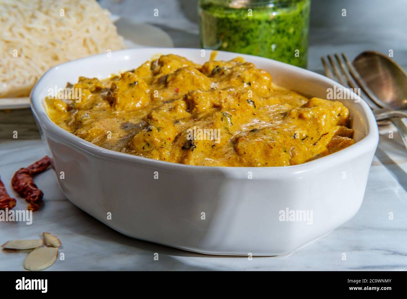 Authentic Indian almond chicken korma curry dinner with basmati rice