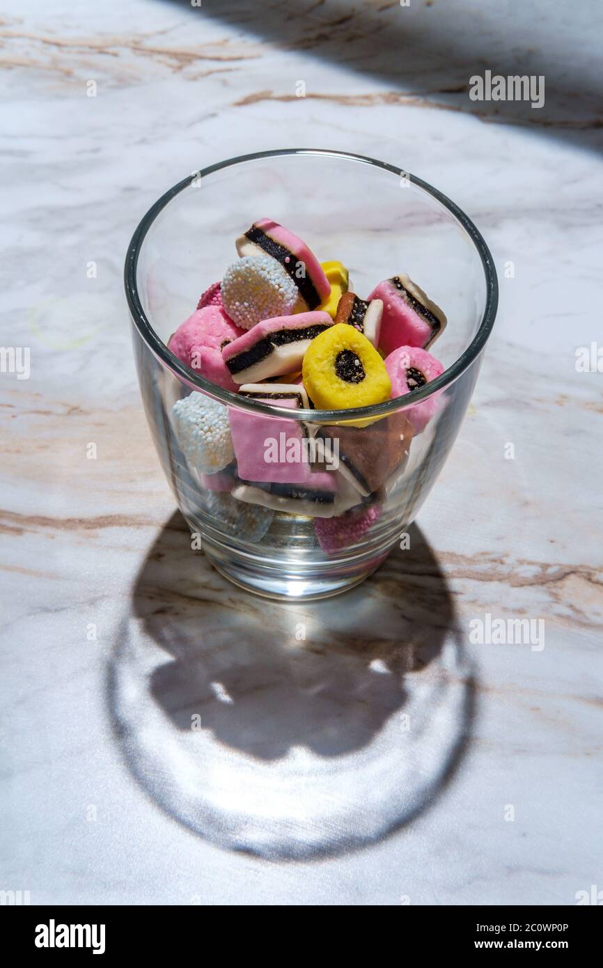 Colorful gourmet English licorice candies on marble table Stock Photo