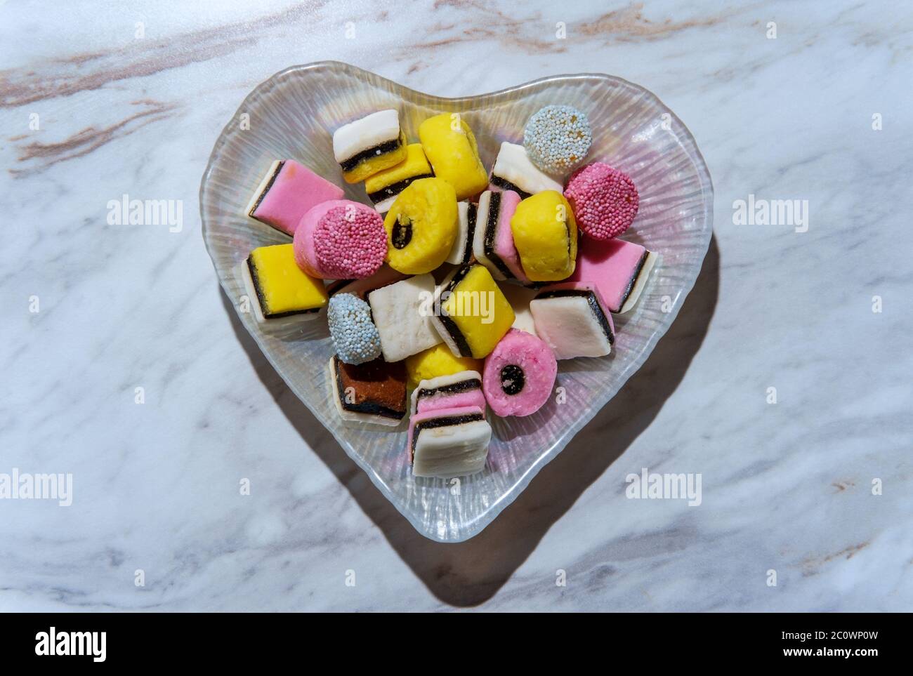 Colorful gourmet English licorice candies on marble table Stock Photo