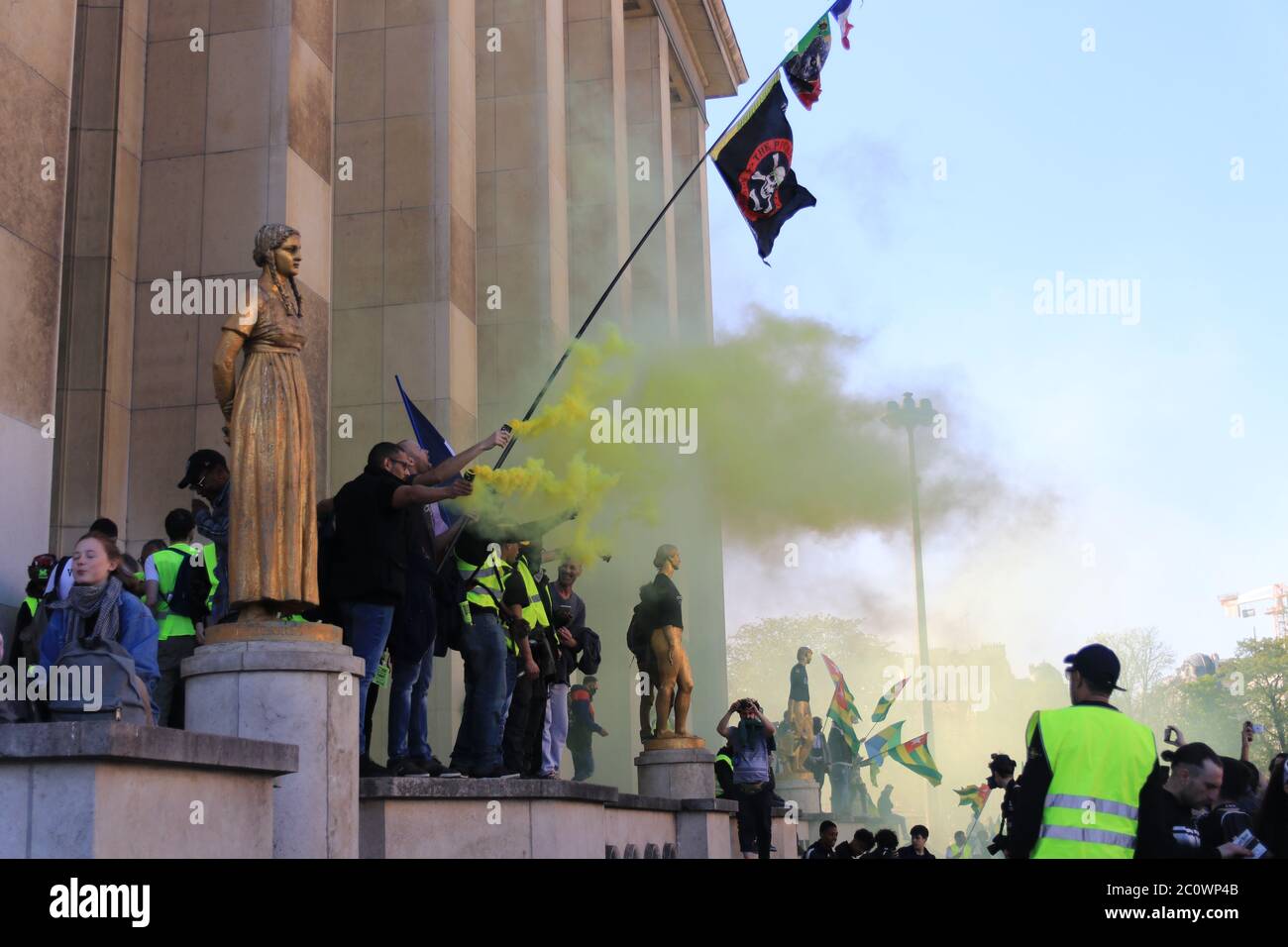 Yellow vest riots with smoking flares at Trocadéro in Paris France Stock Photo