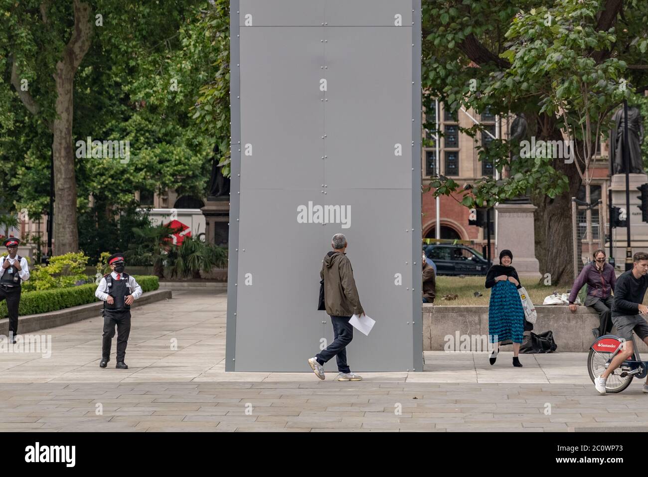 Winston Churchill memorial statue stands encased in protective cladding in Parliament Square ahead of further Black Lives Matter (BLM) protests, UK. Stock Photo