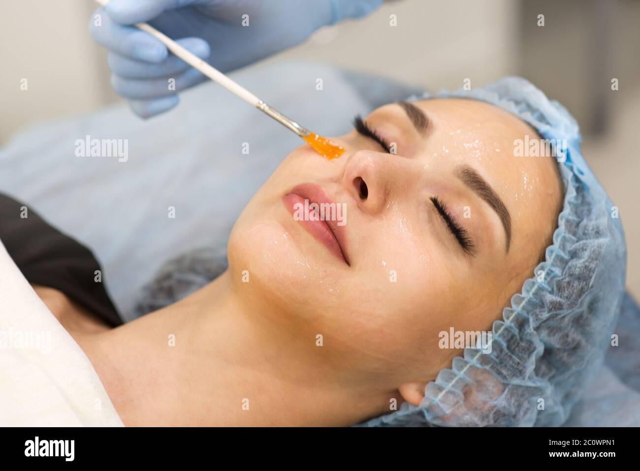 Face cleaning in a beauty salon - close-up of a woman's face Stock Photo