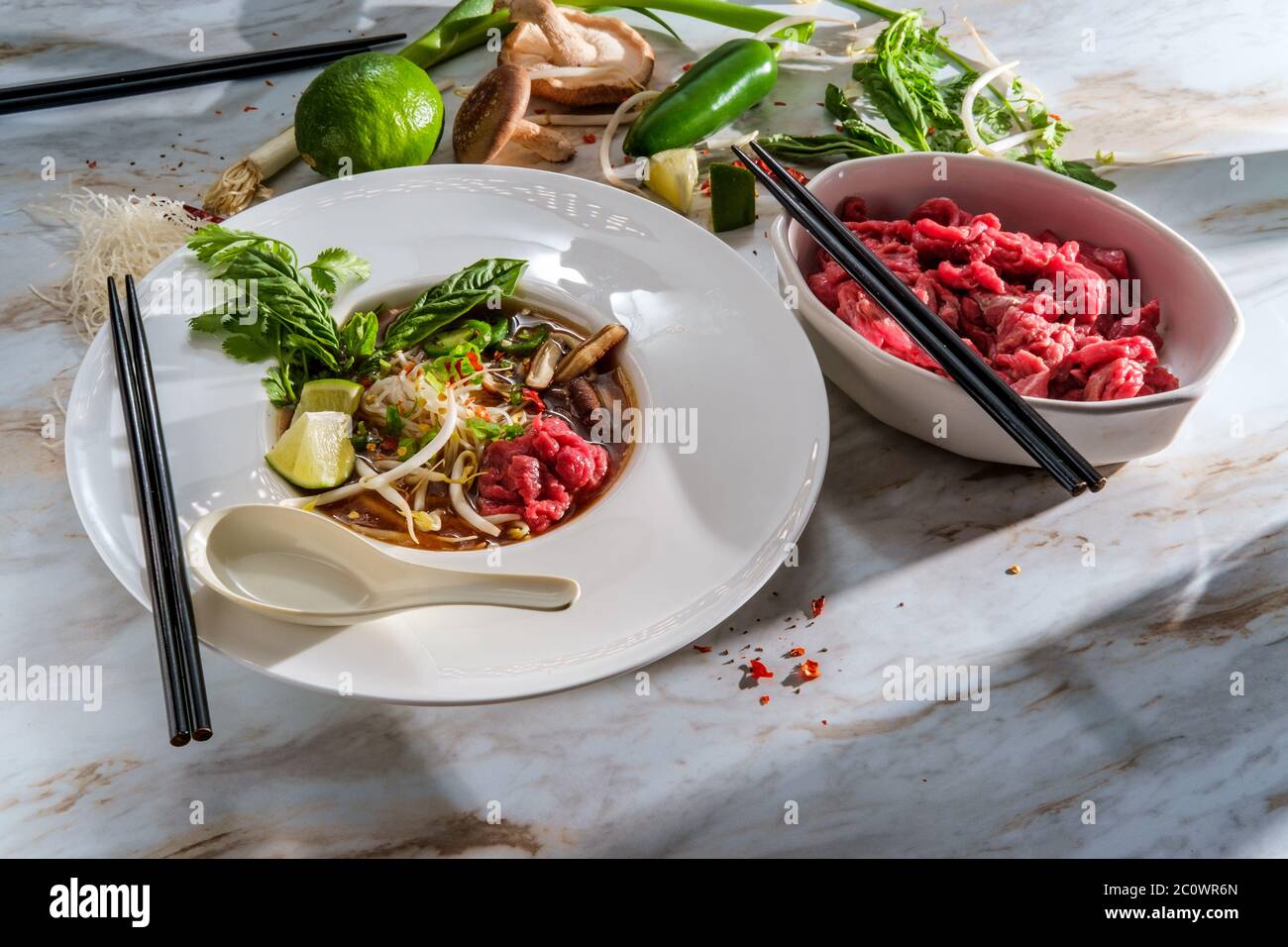 Traditional Vietnamese pho bo beef noodle soup served with noodles