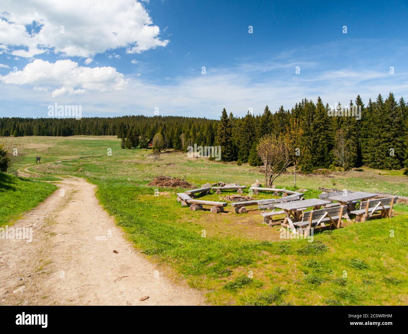 Campfire ring with benches and tables in rural countryside Stock Photo