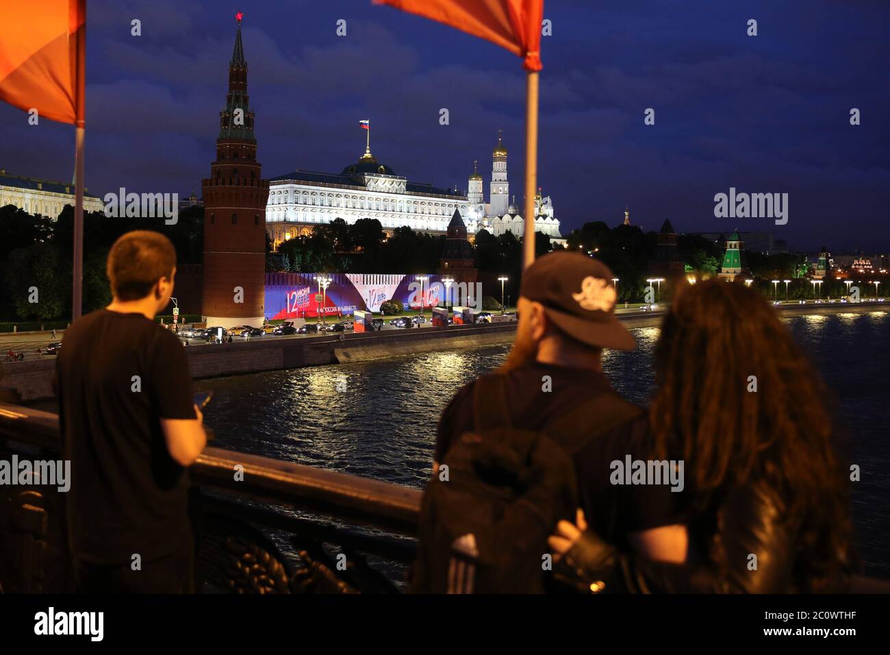 Moscow Russia June 12 People Watch A Light Show In The Russian National Colours Projected Onto The Kremlin Wall By The Moskva River During A National Holiday Known As Russia