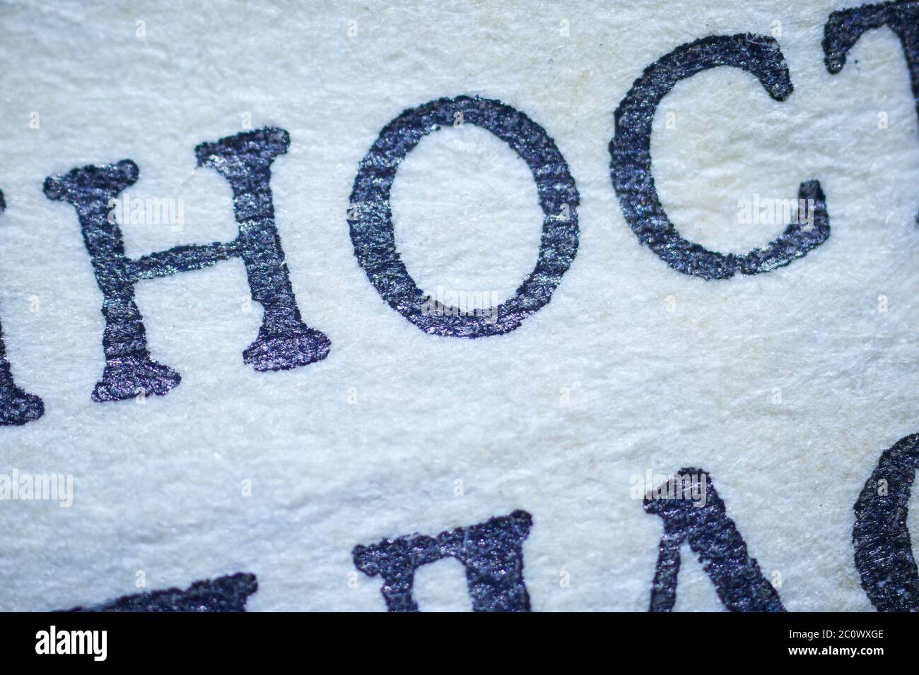 Black letters on white paper under a microscope Stock Photo Alamy