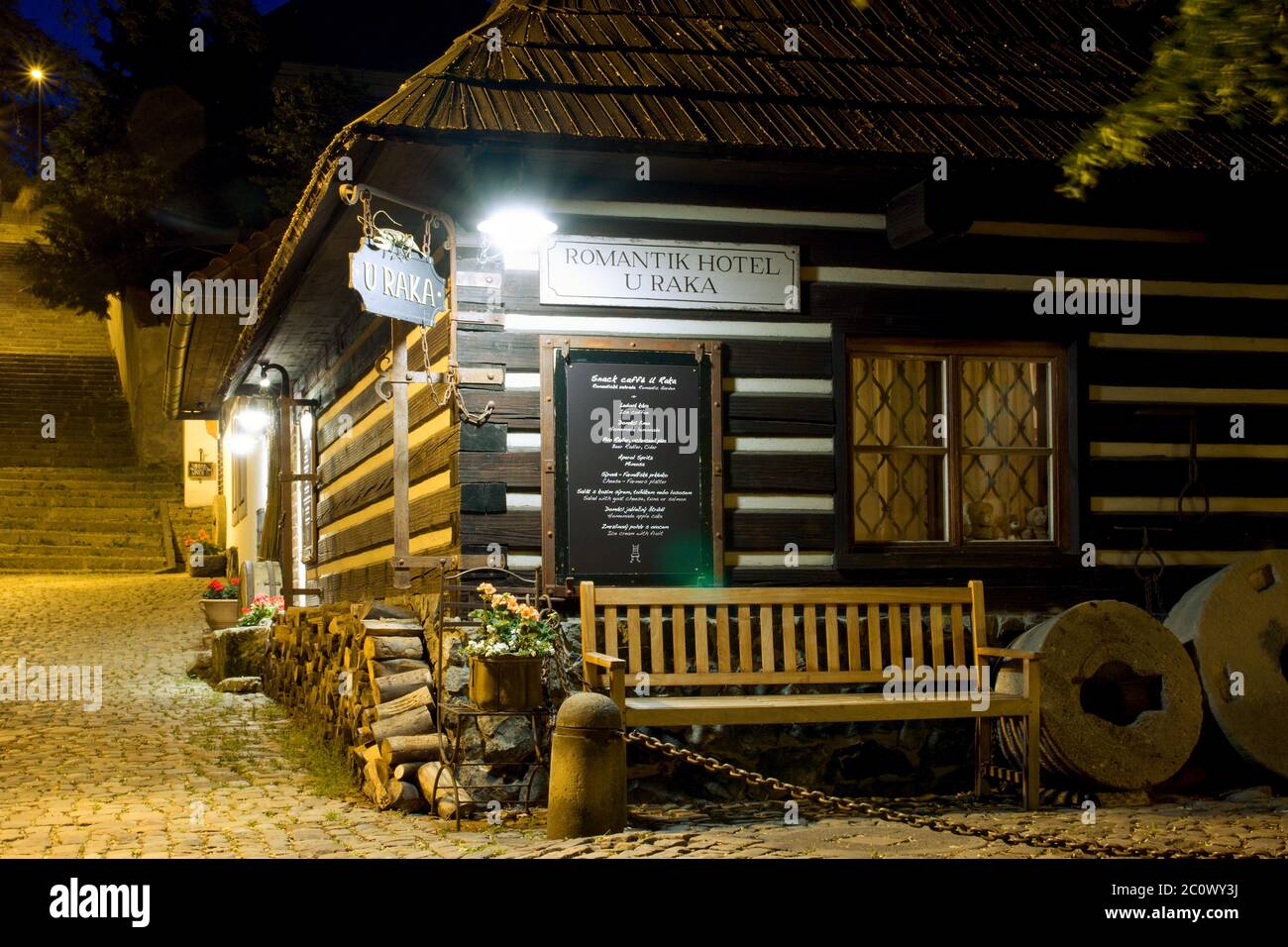 Cute fairytale wooden cottage hotel U Raka in Prague Czech Republic Novy Svet quarter during night Stock Photo
