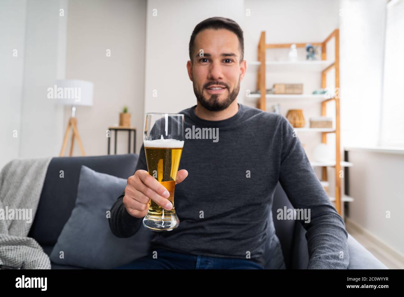 Man Drinking Beverage Beer Alone At Home Stock Photo