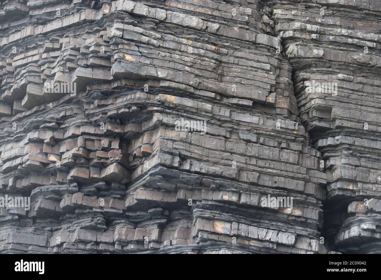 Slate Cliff face very jagged and layers sedimentary rock. High quality photo Stock Photo
