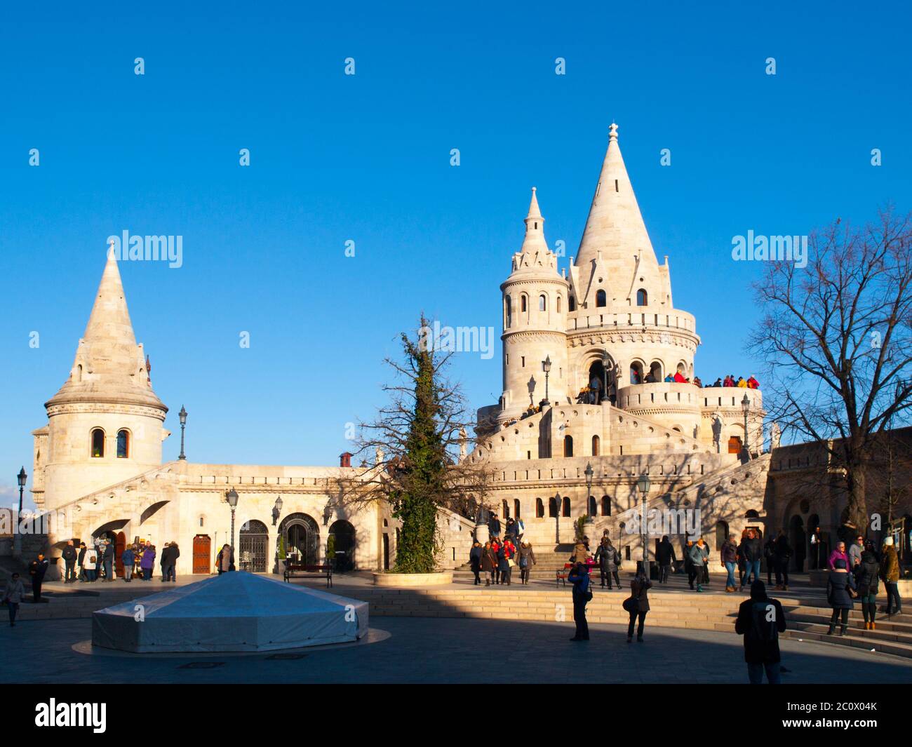 Typical light stone rounded fairy tale towers of Fisherman's Bastion, aka Halaszbastya, on a terrace in neo-Gothic and neo-Romanesque architectural style. Lookout turrets are situated on a Buda bank side of Danube River in Budapest, capital city of Hungary, Europe. UNESCO World Heritage Site Stock Photo