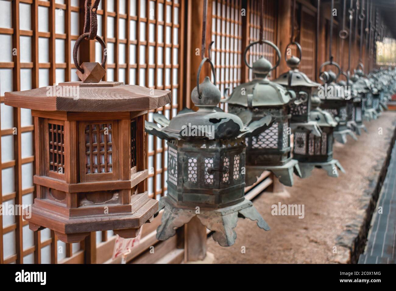 Line of traditional Japanese iron lamps in Nara Japan Stock Photo
