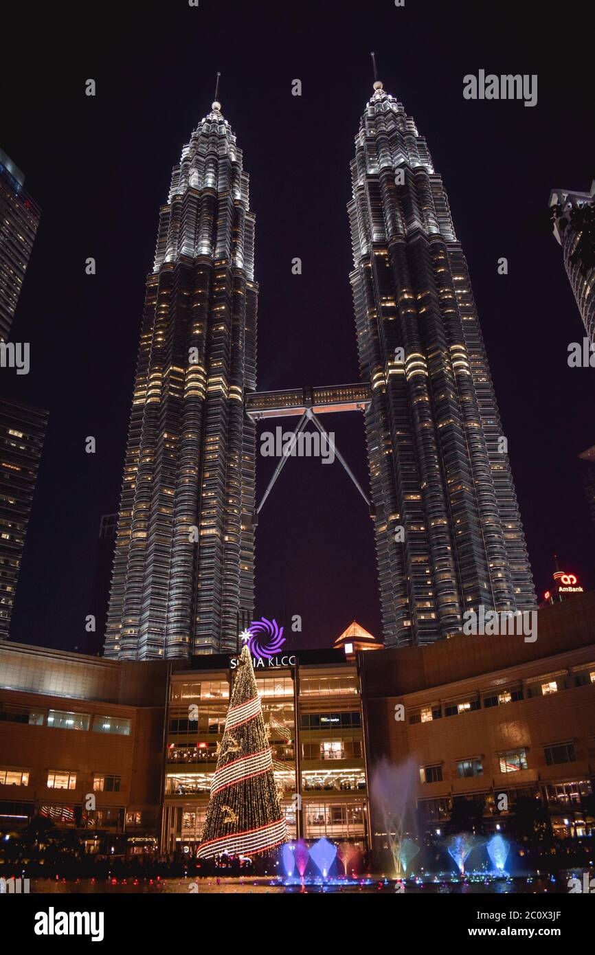 Petronas Towers with a fountain in the KLCC park in Kuala Lumpur