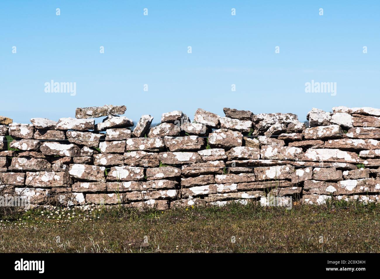Weathered traditional dry stone wall made of limestones on the island Oland in Sweden Stock Photo