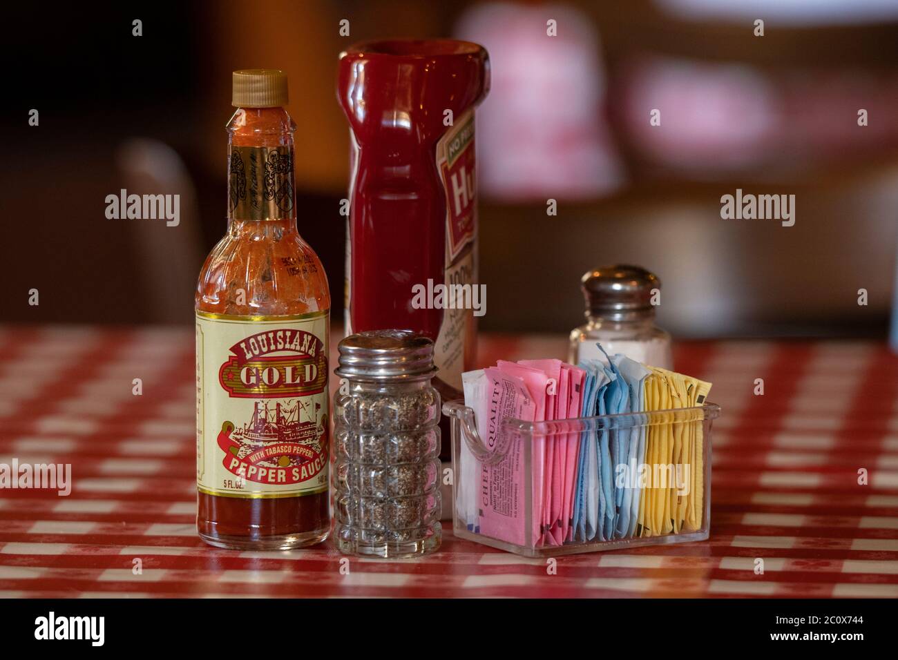 USA, Louisiana, New Orleans, French Quarter,  condiments on table in restaurant Stock Photo