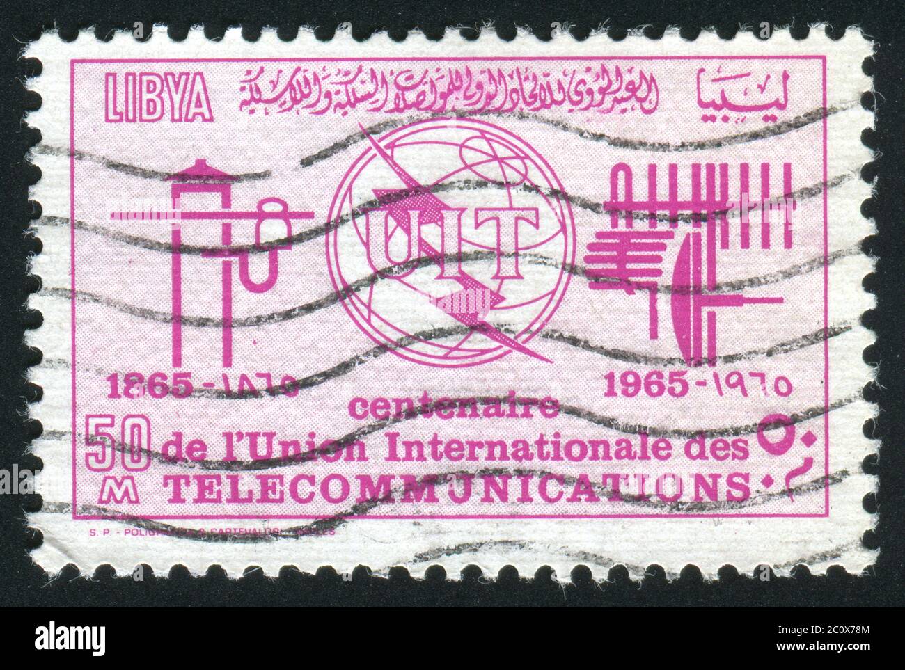 LIBYA - CIRCA 1970: Emblem of the international telecommunication company, circa 1970. Stock Photo