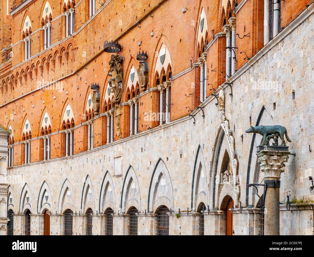 Architectural detail of front facade of Siena Town Hall, Palazzo Pubblico, at the Piazza del Campo, Tuscany, Italy, Europe. Stock Photo