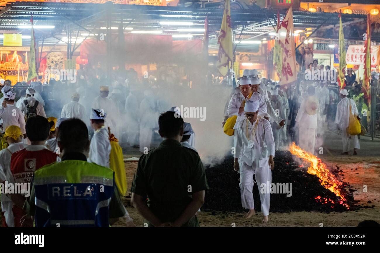 Devotees in the fire walking ceremony during the Taoist Festival of the Nine Emperor Gods at the Kau Ong Ya Temple Selangor, Malaysia Stock Photo