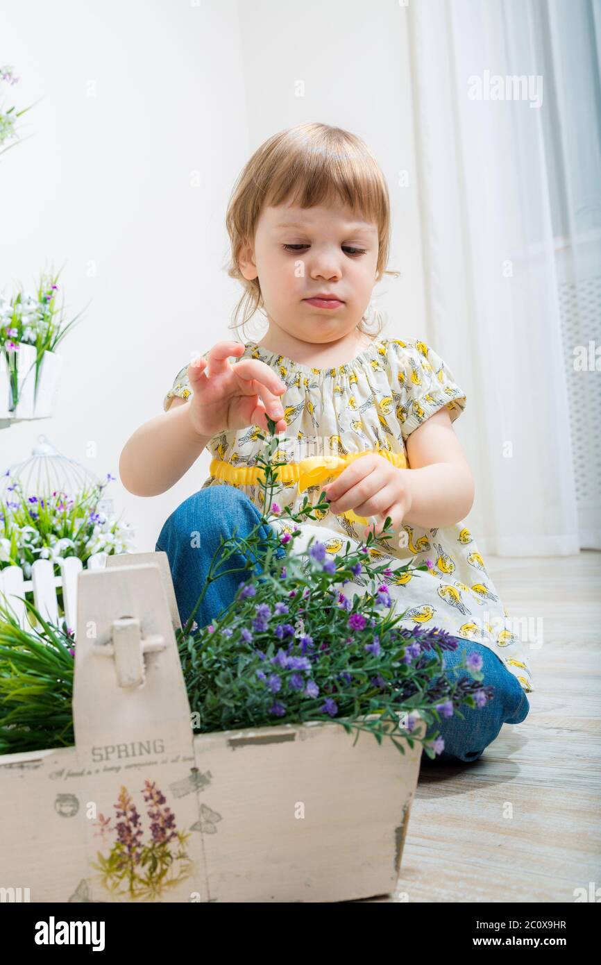 Cute girl with spring flowers Stock Photo - Alamy
