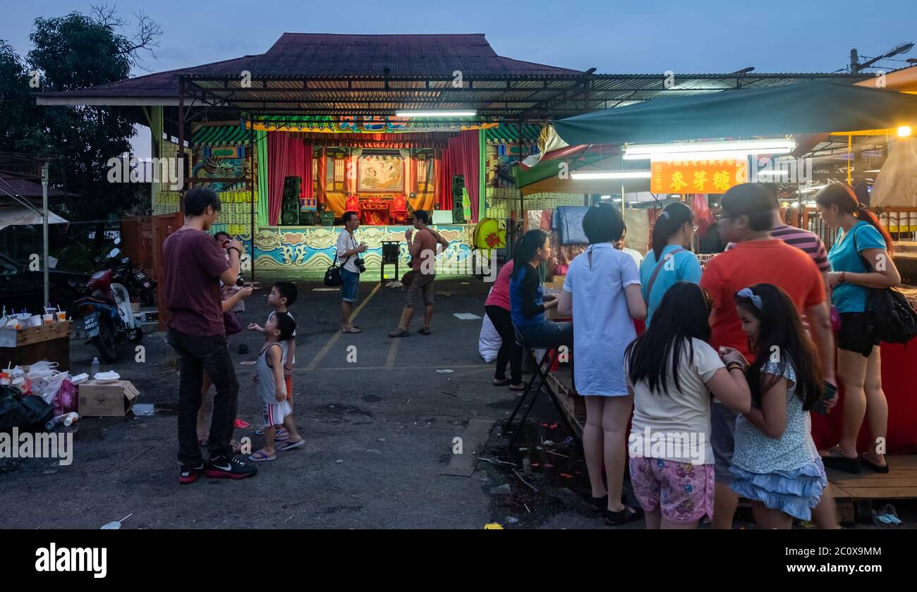 People at the Chinese Opera theater stage waiting for performance to begin, Ampang, Selangor, Malaysia Stock Photo