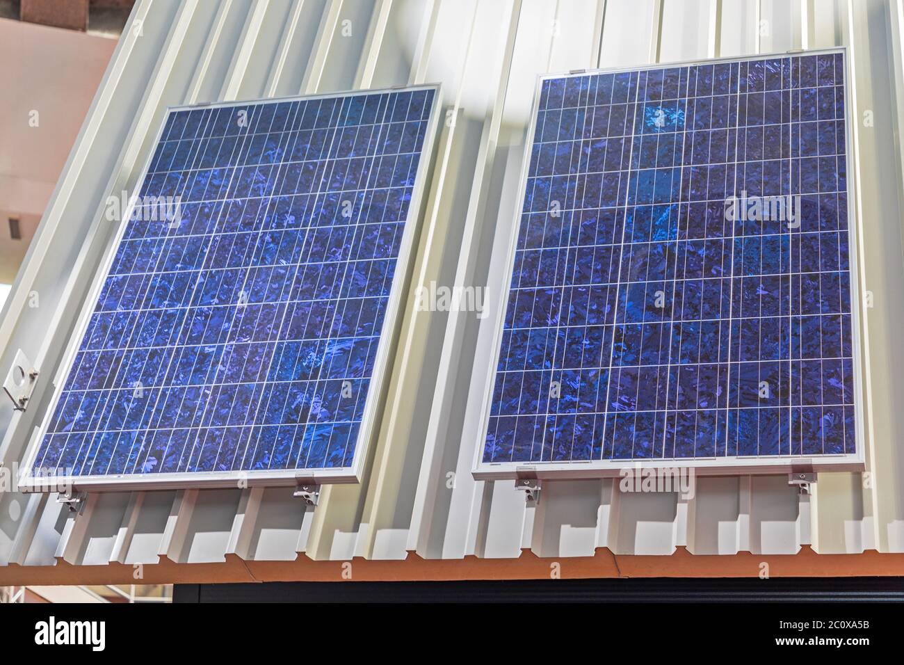 Two Solar Panel Cells at House Roof Stock Photo Alamy
