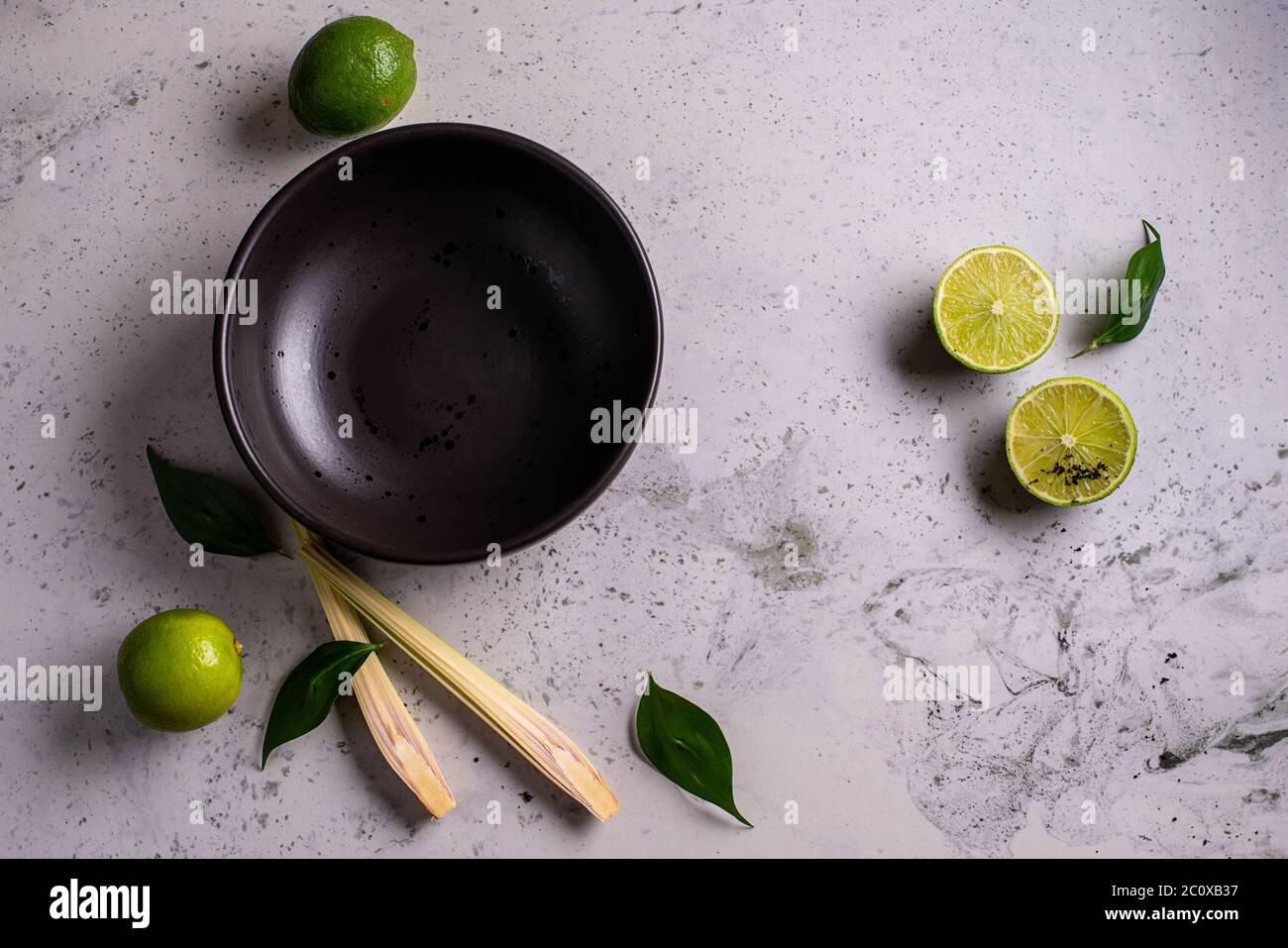 Black empty plate on marble, flatlay - stylish tableware, table decor and food menu concept. Serve the perfect dish Stock Photo