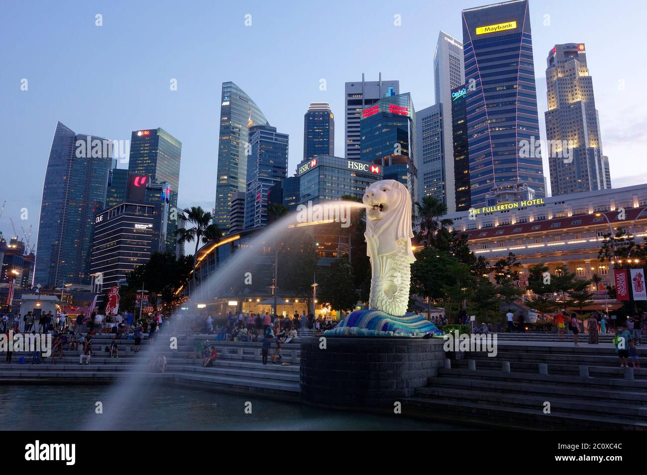 Night view of Merlion Park with Merlio sculpture and fountain and downtown financial centre