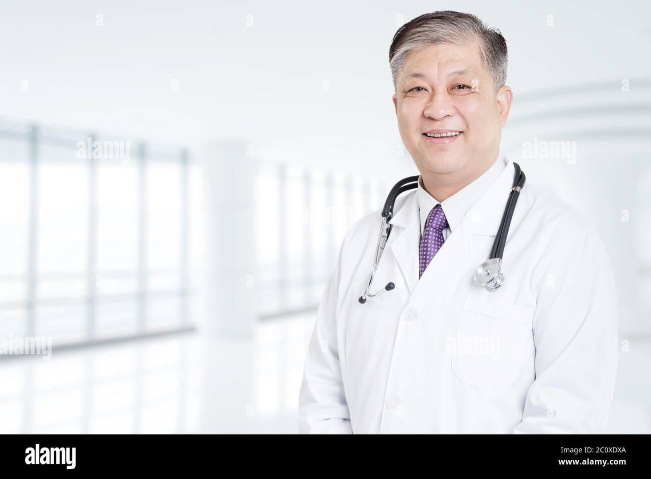 Smiling asian man doctor hi-res stock photography and images - Alamy