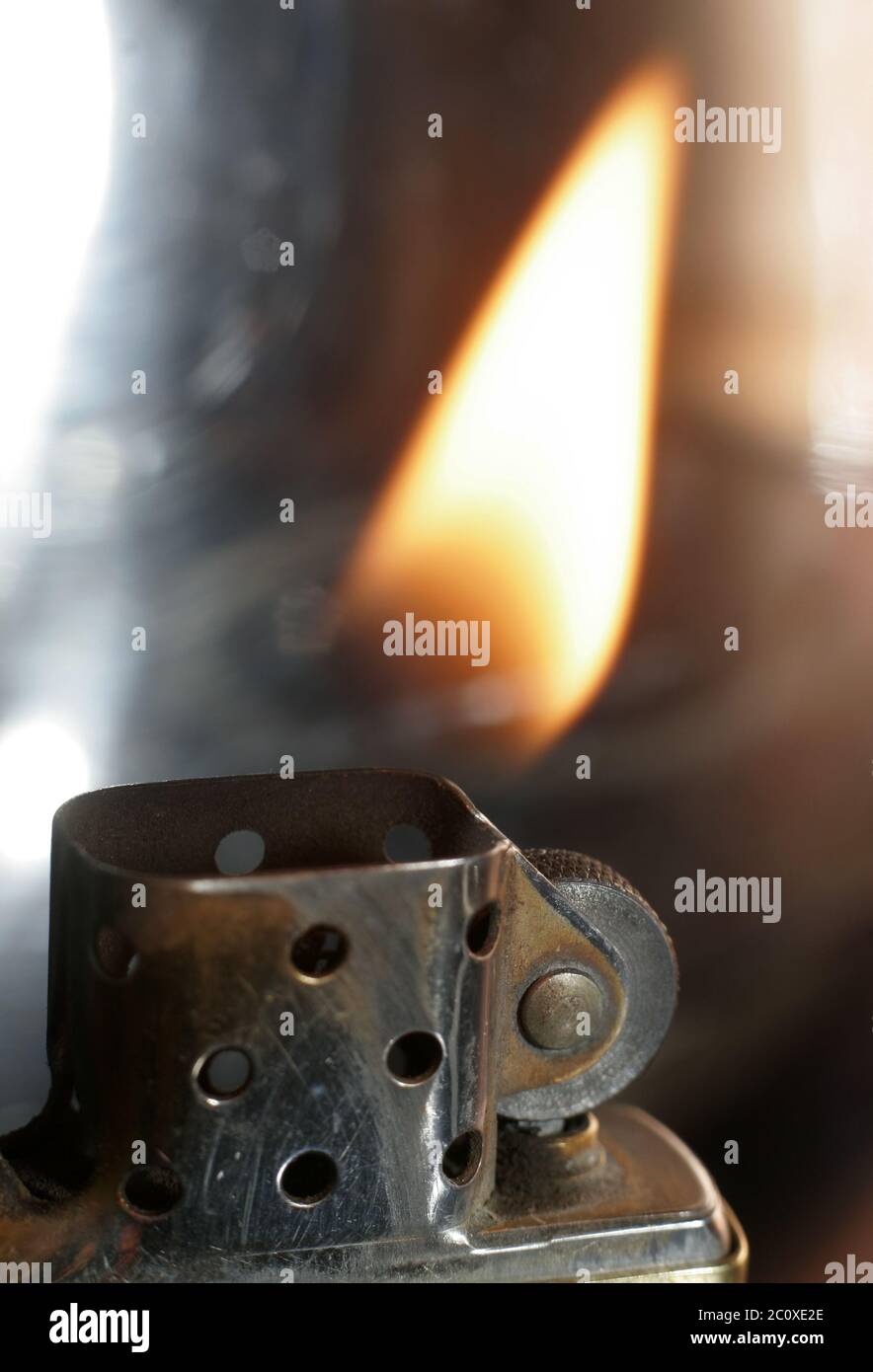 Really great macro photo of a zippo lighter. Sharp close-up and stunning flame. Stock Photo